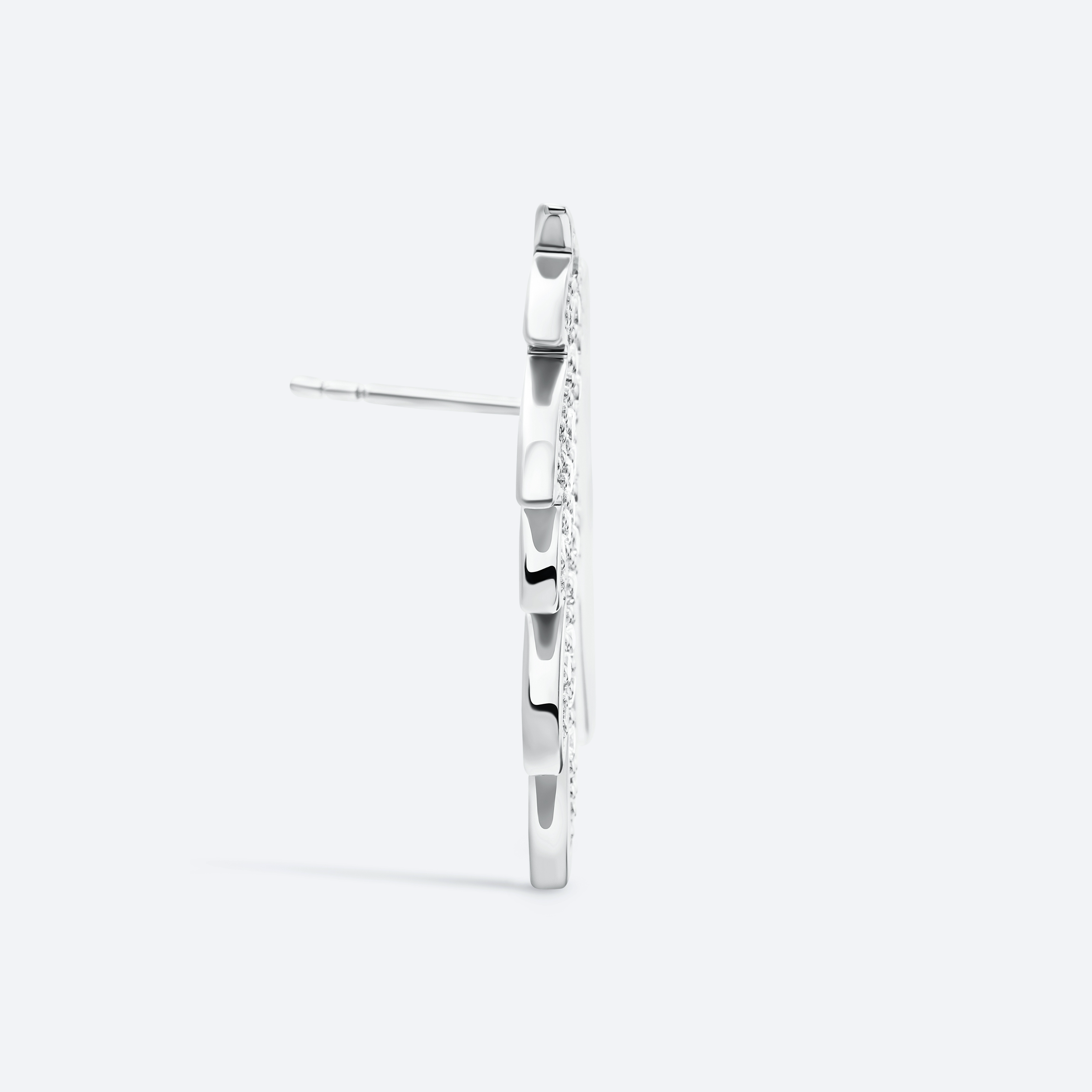 Silver hoop earrings on a light gray background