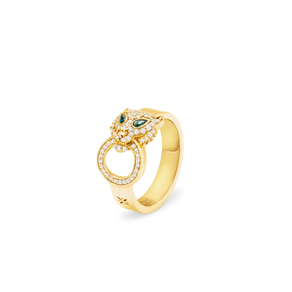 Gold ring with gemstones on a white background