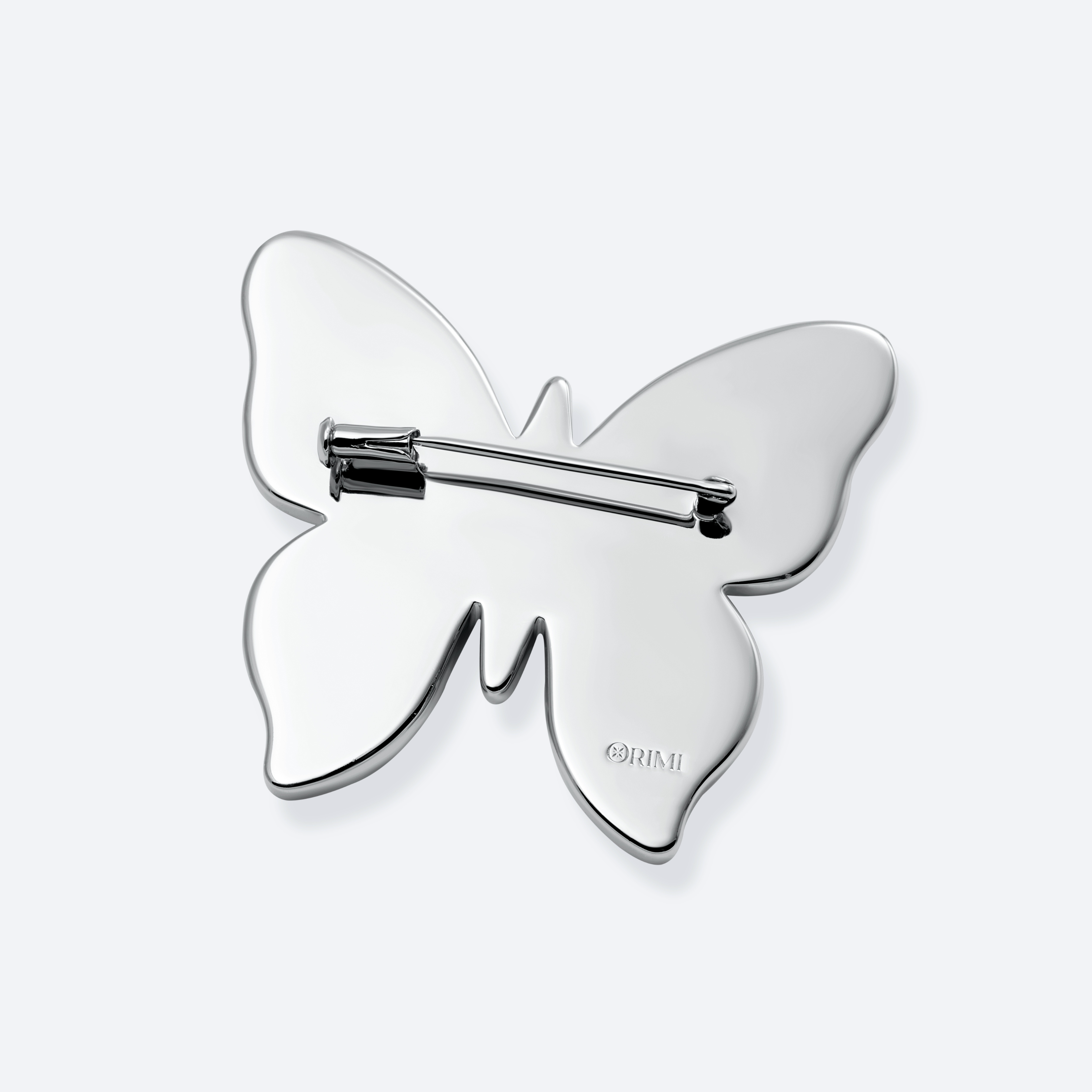 Butterfly-shaped metal hair clip on a white background