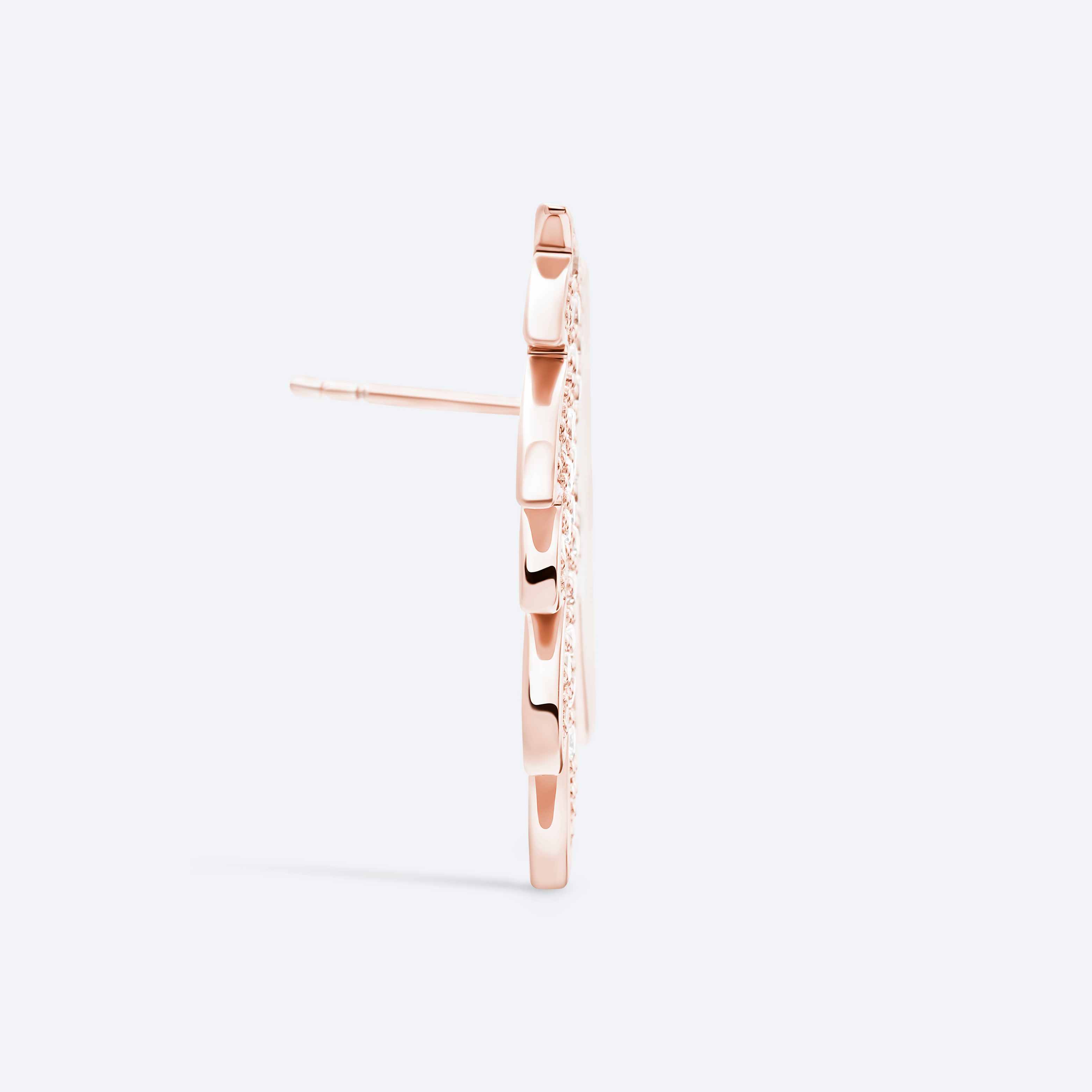 Rose gold hoop earrings on a light gray background